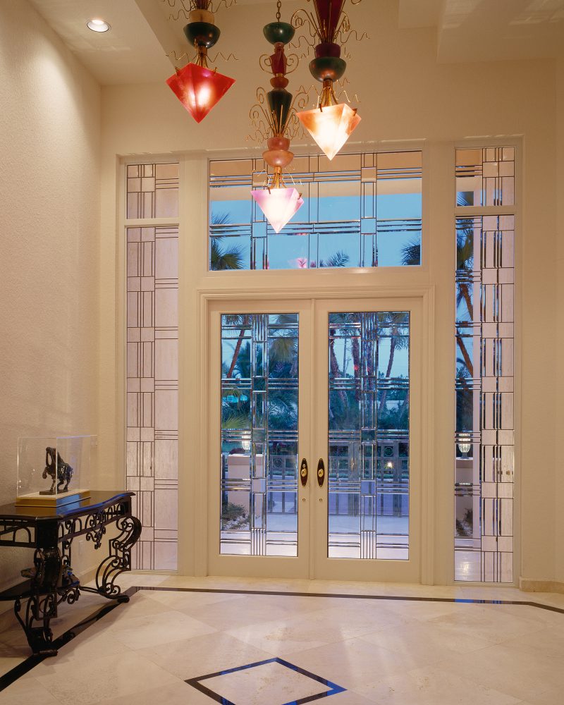 Contemporary entryway with clear glass in squares and rectangles.