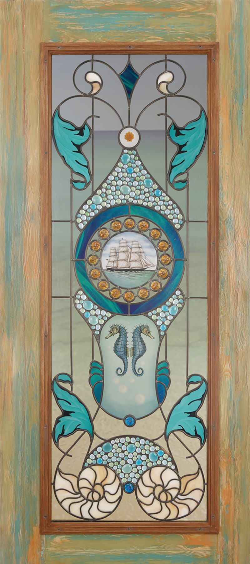 Small contemporary style door with glass painting, rondels, and blues, tans, and clear textured glass.