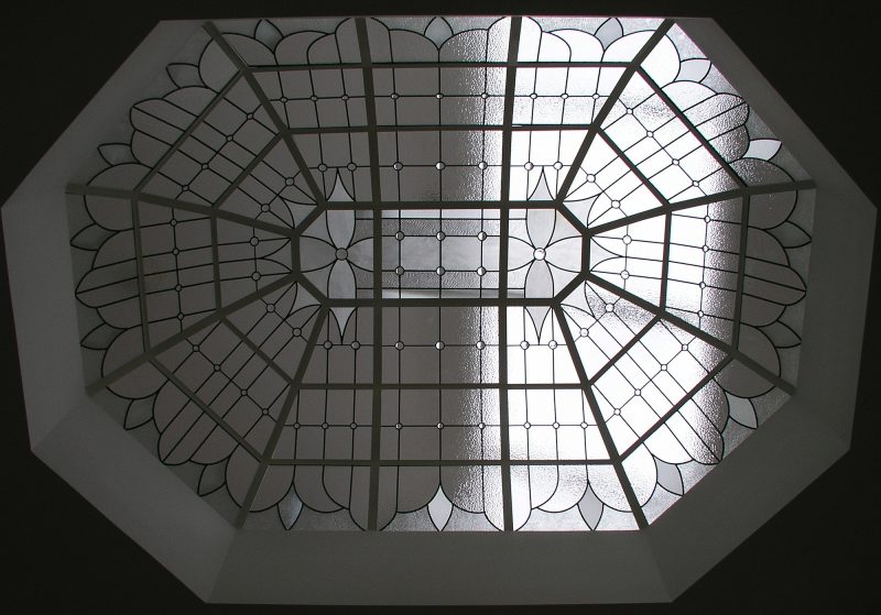 elongated octagon skylight dome with traditional stained glass design. All clear, textured glass