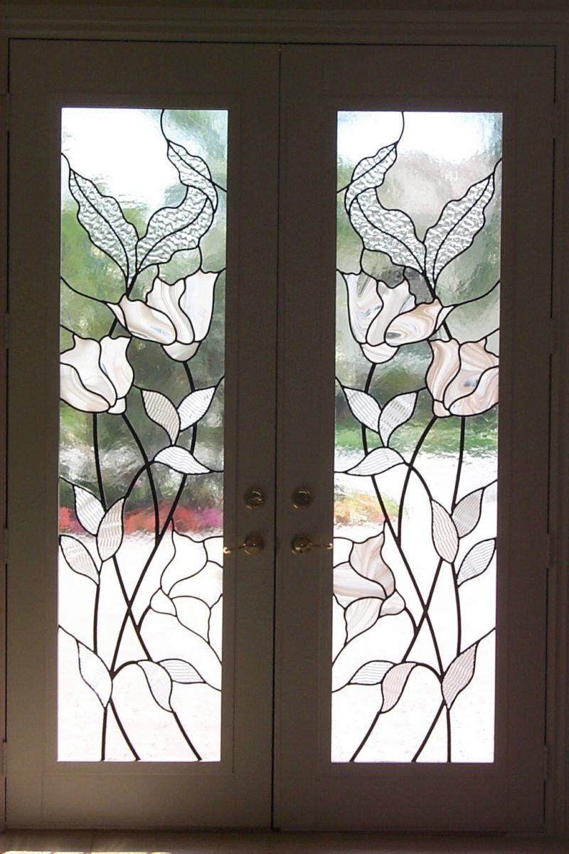 Entryway of flowers with white, clear glass and various clear textured glass.