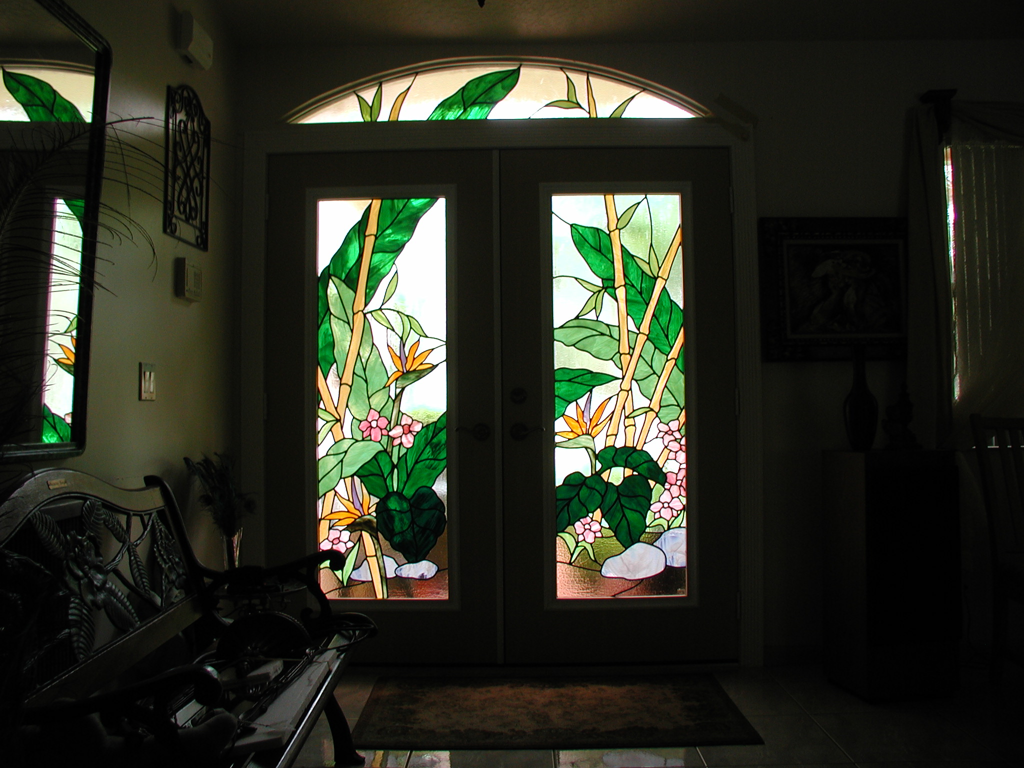 Entryway of foliage and nature with green, orange, pink, brown, and clear texture glass in a Contemporary style.