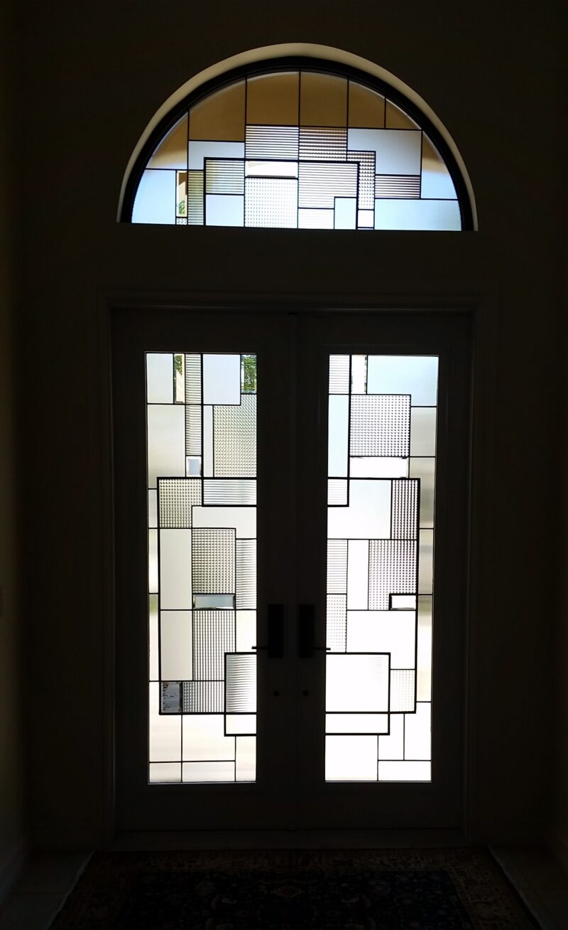 Entryway with clear and clear textured glass in a Contemporary style.