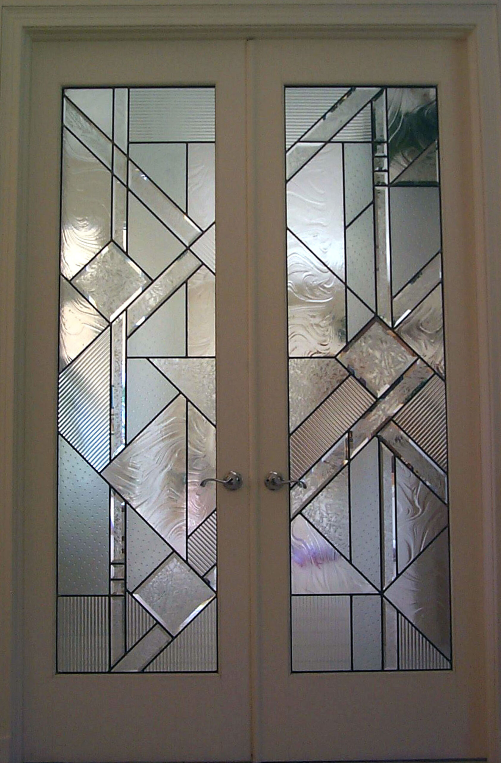Doorway with clear textured glass in a Contemporary style.