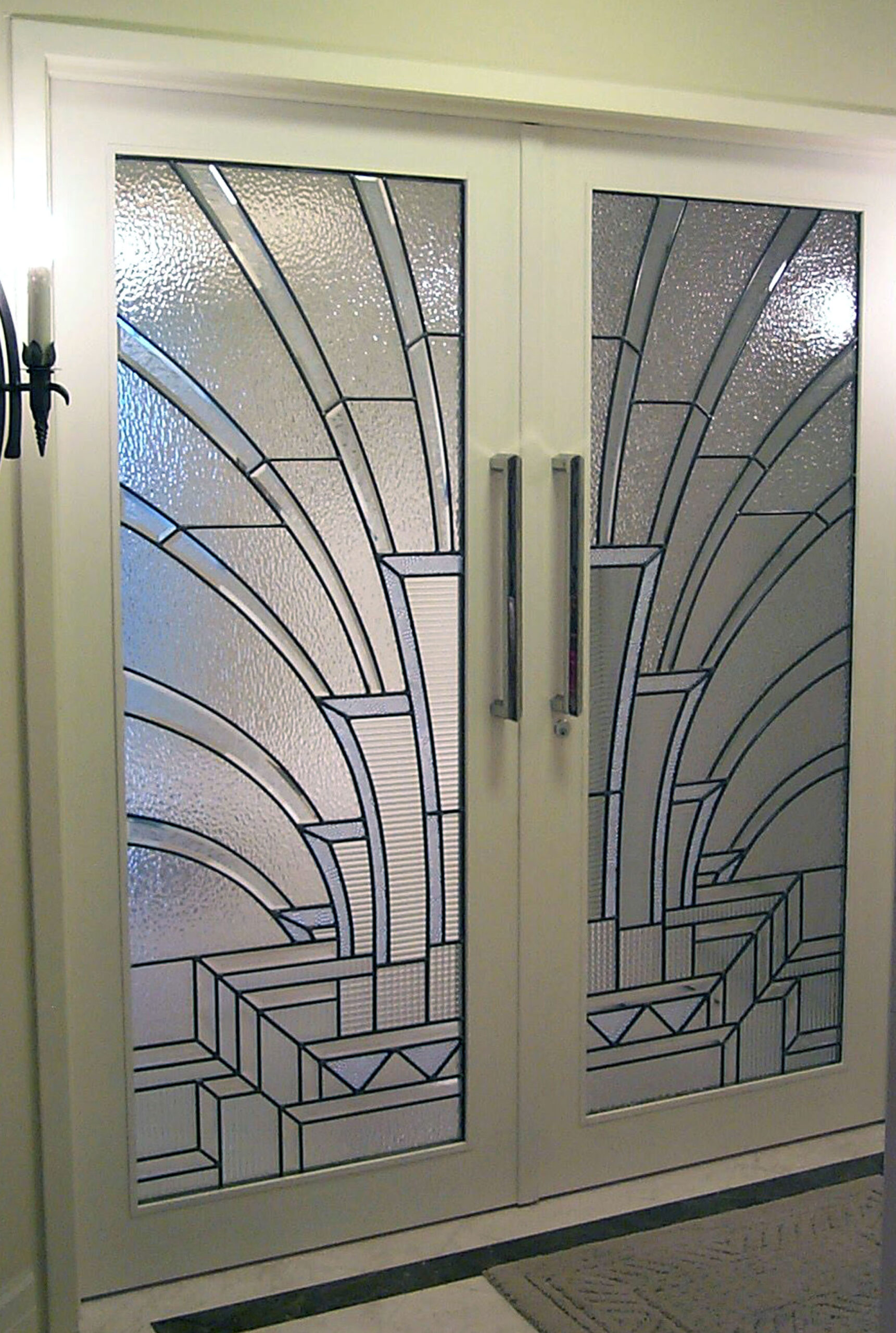 Doorway with clear textured glass in an art deco style.