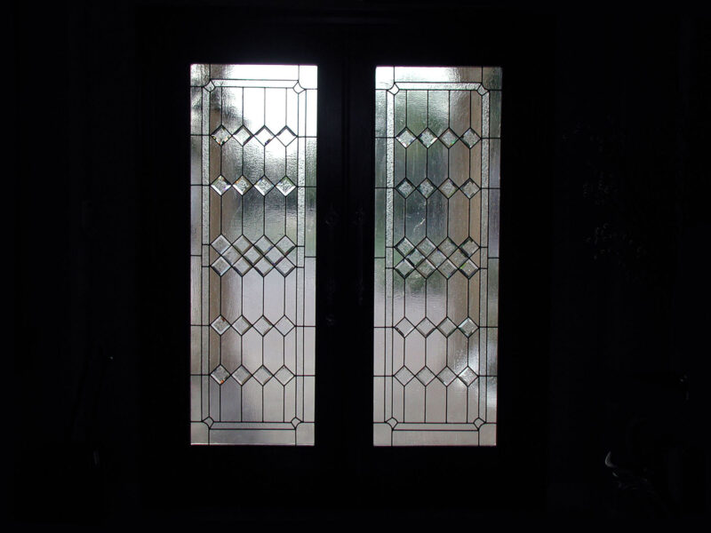 Doorway with clear textured glass in a Contemporary style.