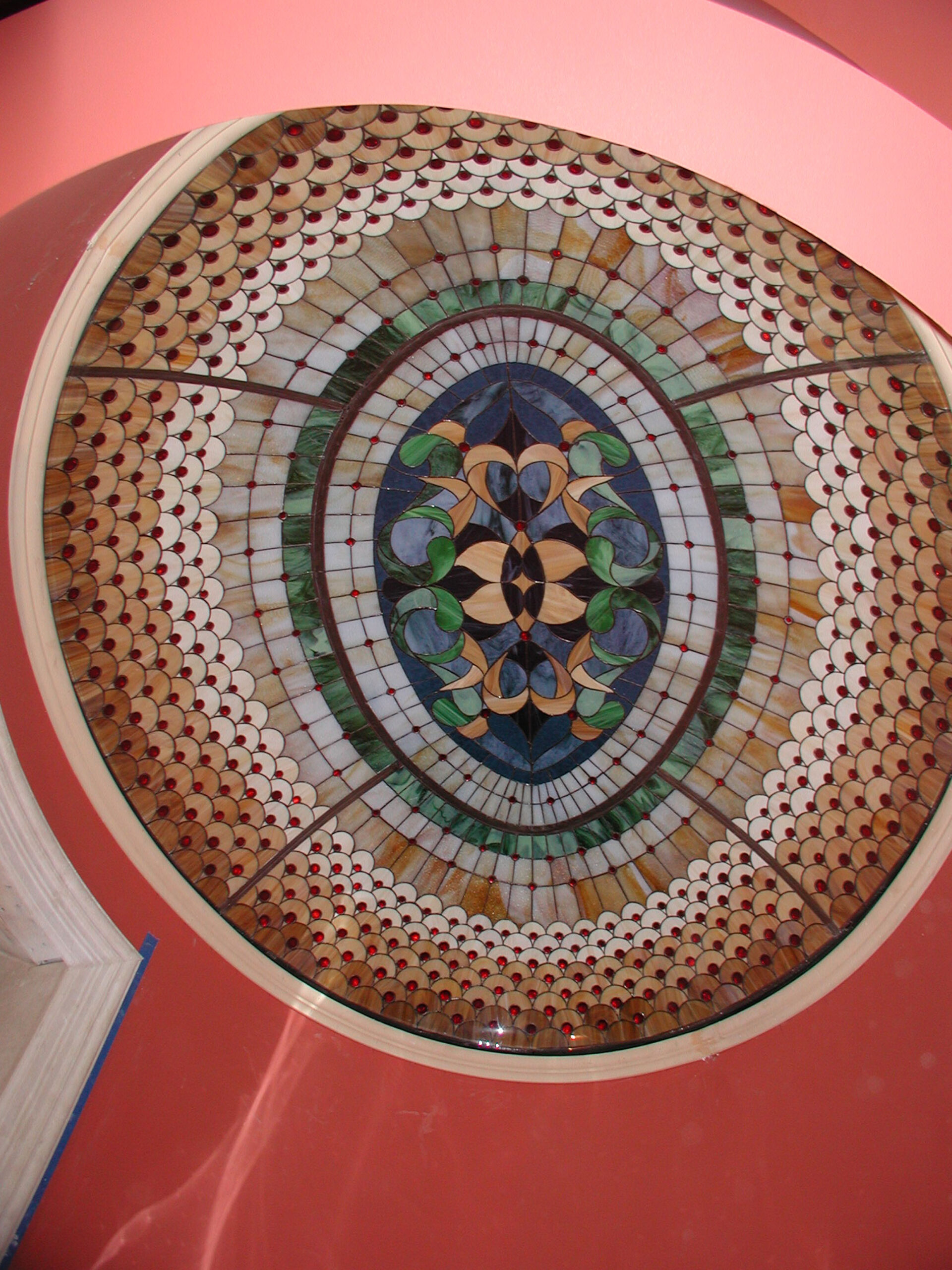 Ceiling dome with brown, beige, green, and blue glass in a Traditional style.